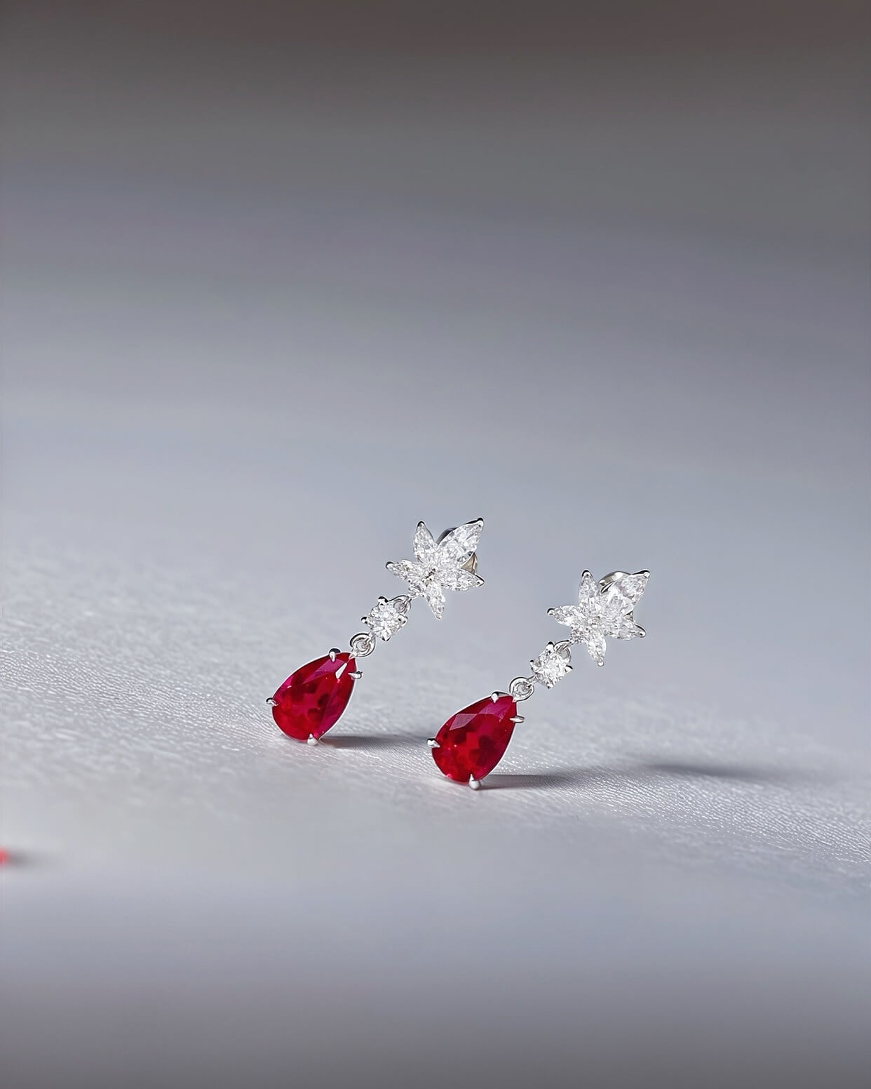 Snowflake design pear cut lab grown ruby earrings stud