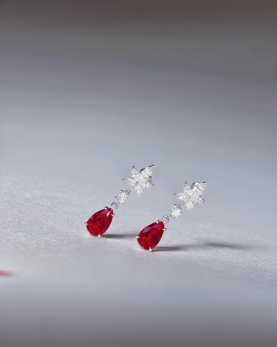 Snowflake design pear cut lab grown ruby earrings stud