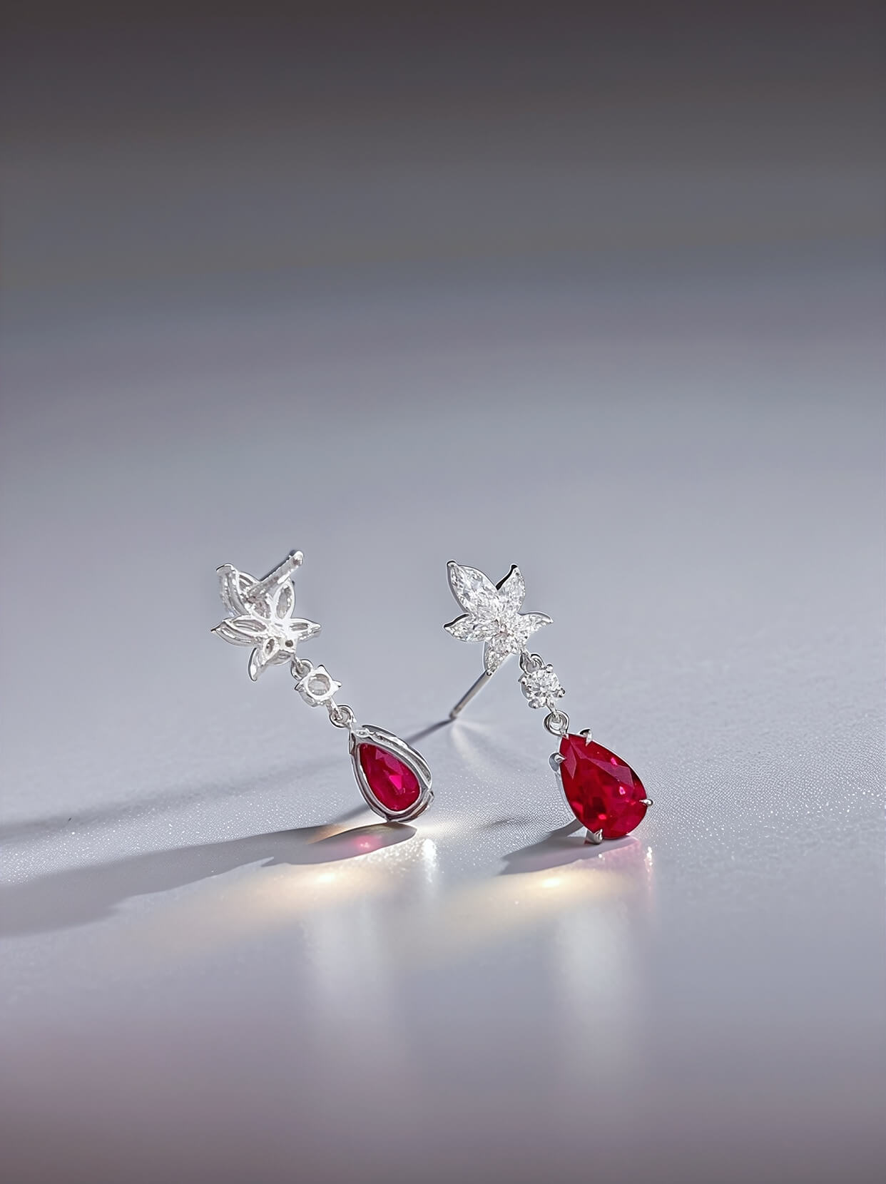 Snowflake design pear cut lab grown ruby earrings stud