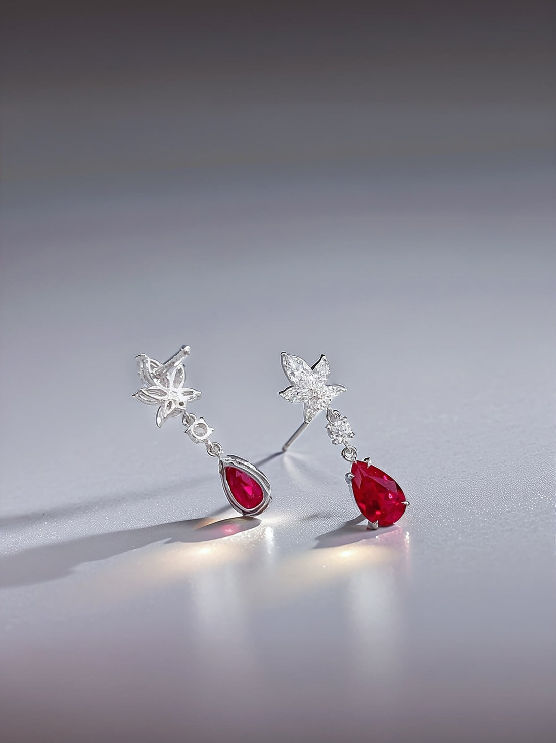 Snowflake design pear cut lab grown ruby earrings stud