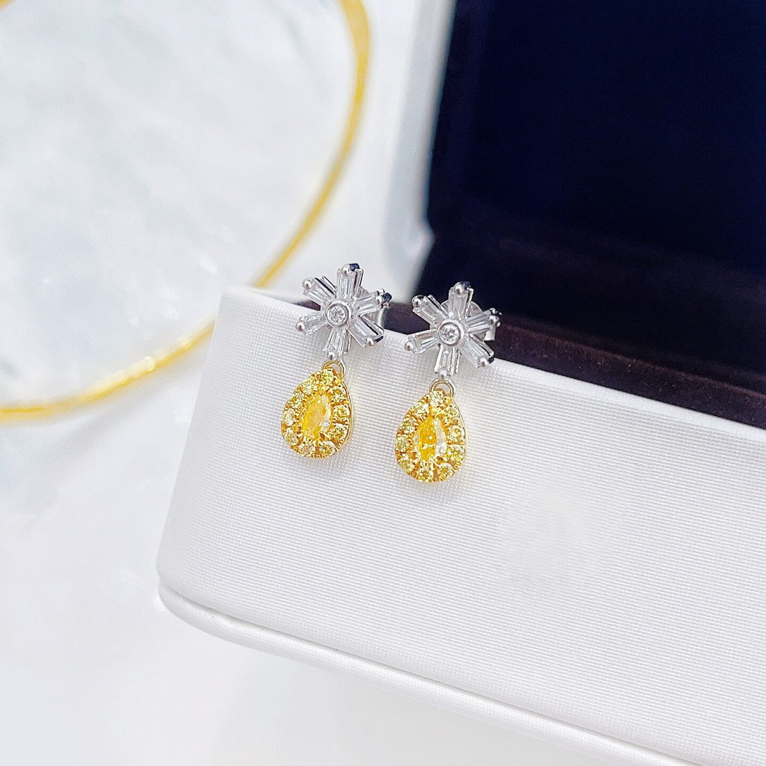 Snowflake design pear cut lab grown yellow diamond earrings stud
