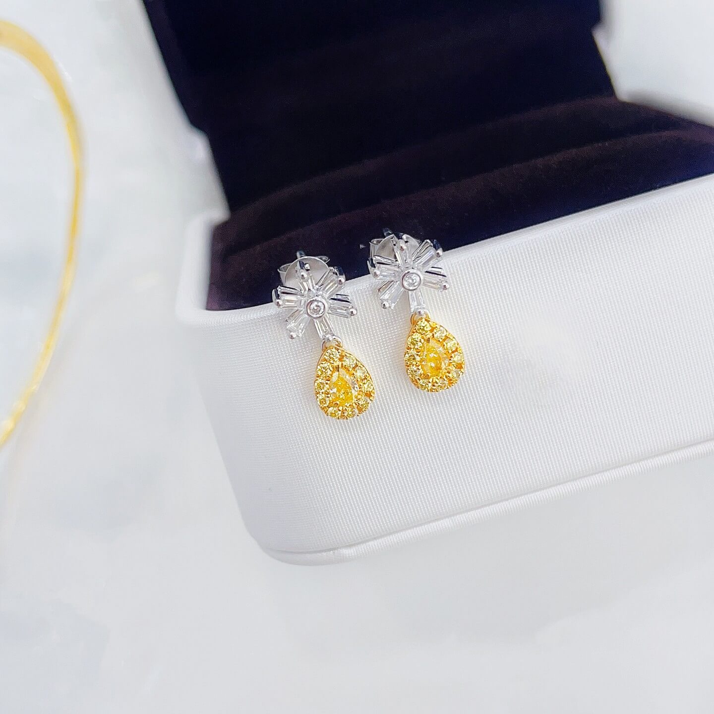 Snowflake design pear cut lab grown yellow diamond earrings stud
