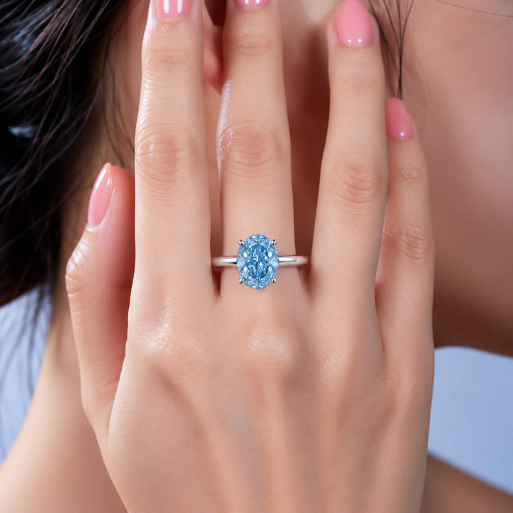 18K gold oval cut lab grown blue diamond engagement ring