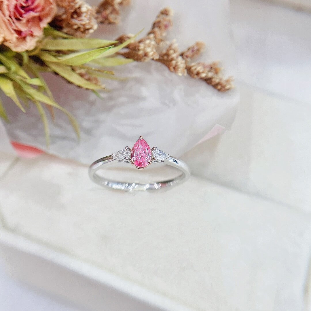 Pear cut lab grown pink diamond three stones engagement ring