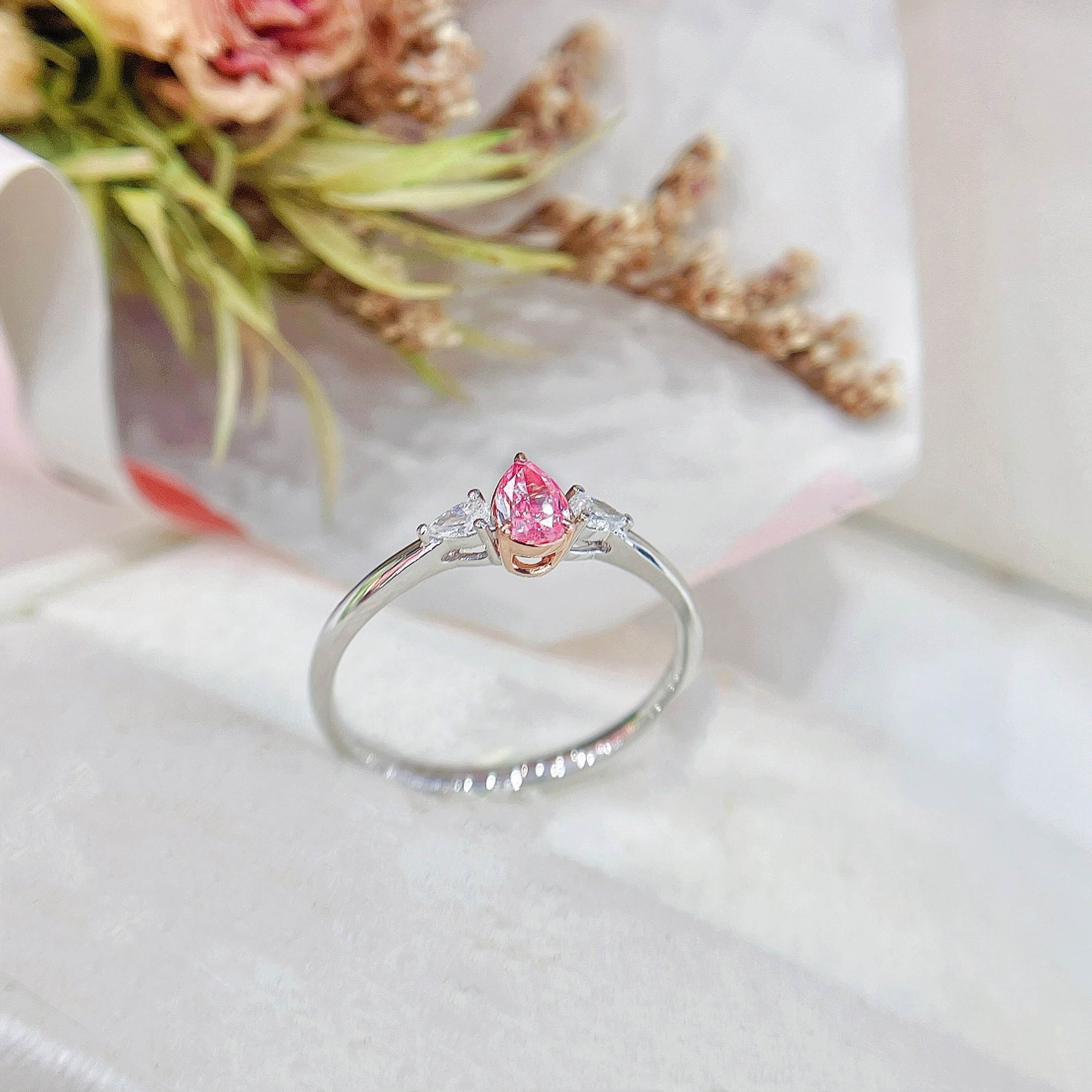 Pear cut lab grown pink diamond three stones engagement ring