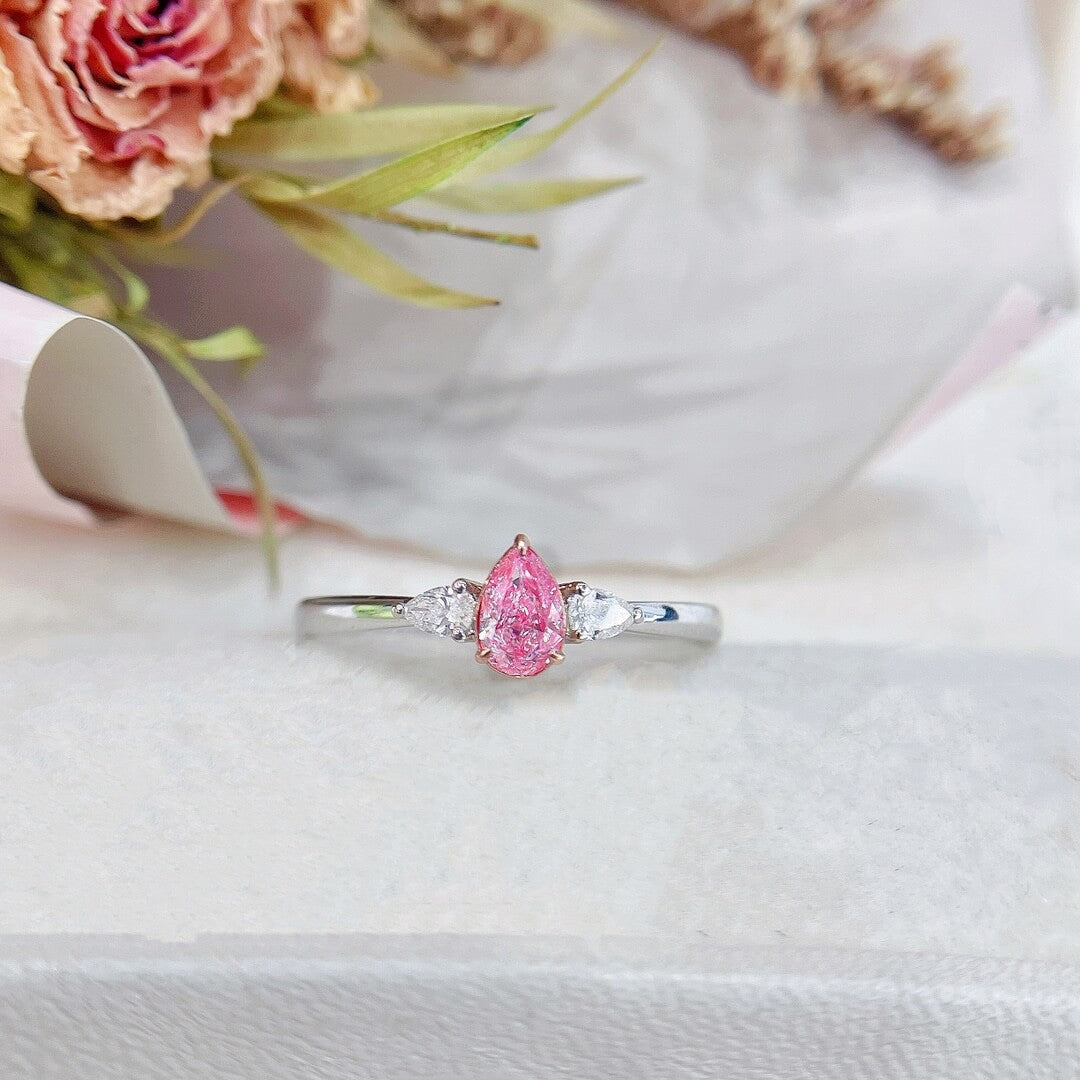 Pear cut lab grown pink diamond three stones engagement ring